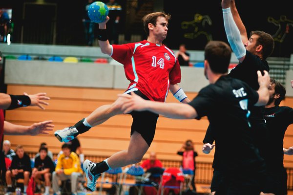 How can professional handball players increase their shooting accuracy?